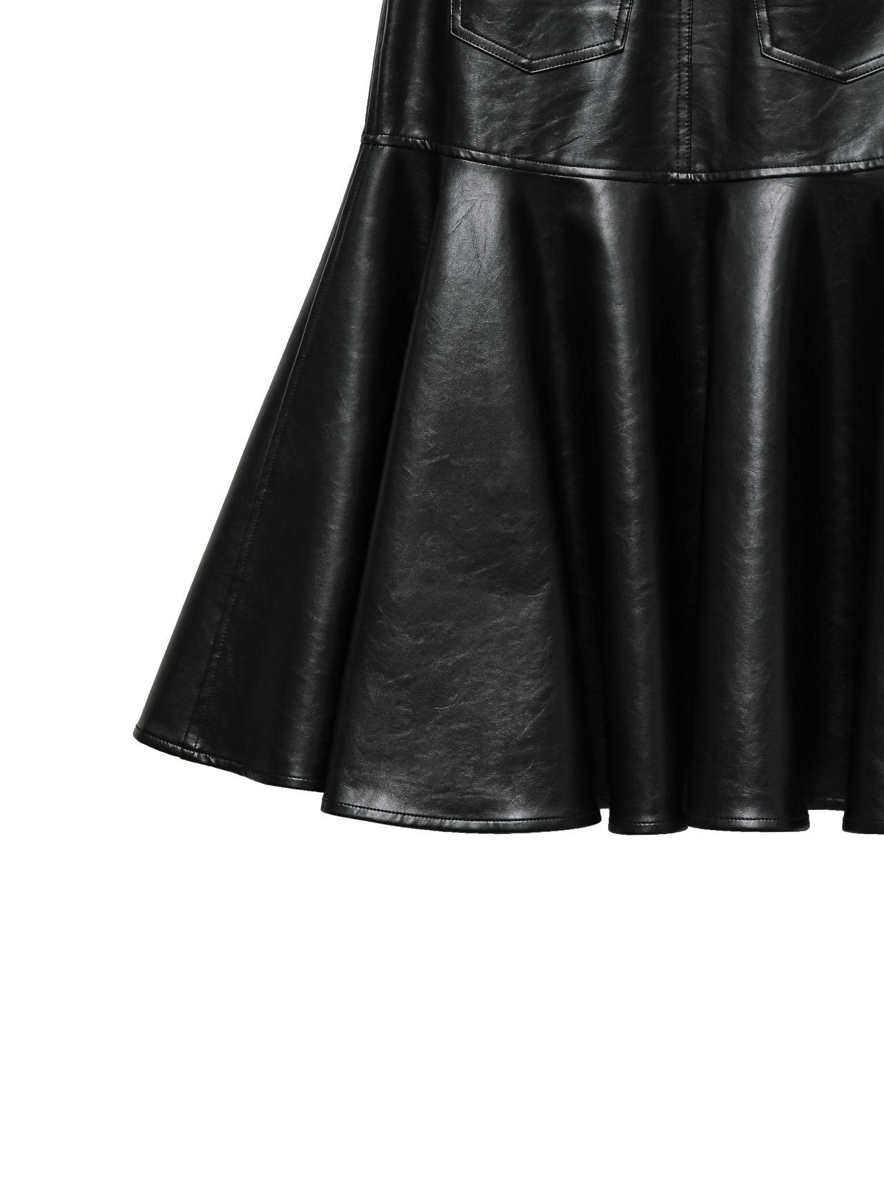 Detail of skirt’s flared peplum hem in smooth black vegan leather.