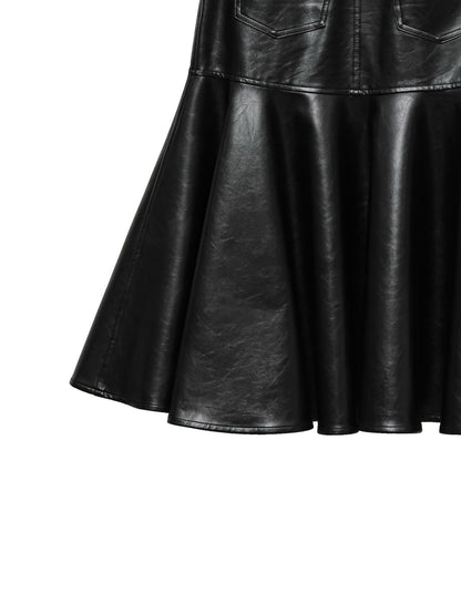 Detail of skirt’s flared peplum hem in smooth black vegan leather.