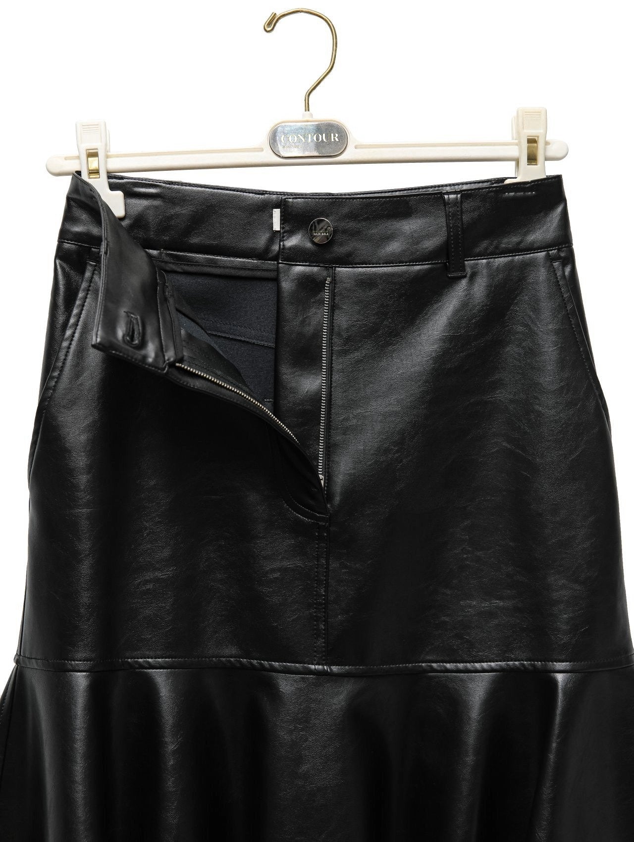 Front view of black vegan leather mermaid peplum skirt hanging on CONTOUR hanger.