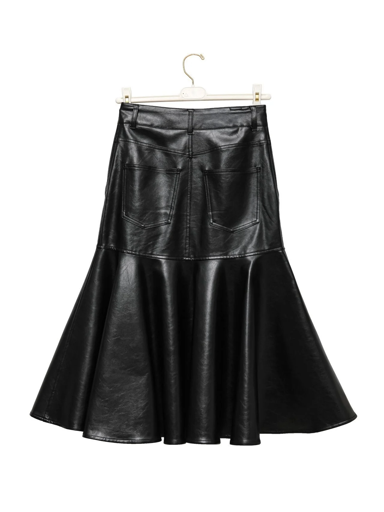 Full back view of black vegan leather peplum-flare midi skirt on hanger.