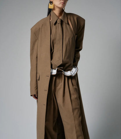 Model styling the Novaro coat layered with matching wide-leg trousers