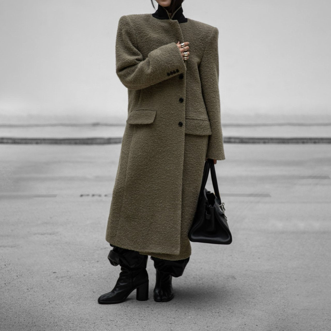 Model wearing oversized khaki beige alpaca-wool bouclé maxi coat full front view
