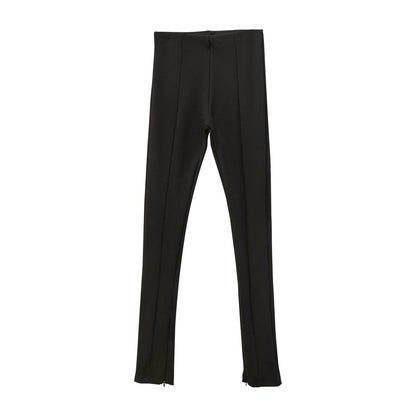 Black ribbed side-slit leggings laid flat showing structured high-rise shape.