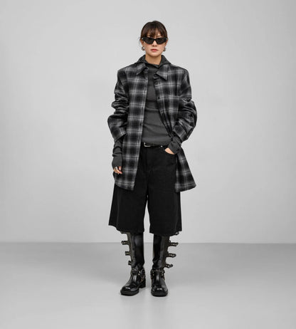 Model wearing the Structured Quilted Check Overshirt open, capturing movement and structured silhouette.
