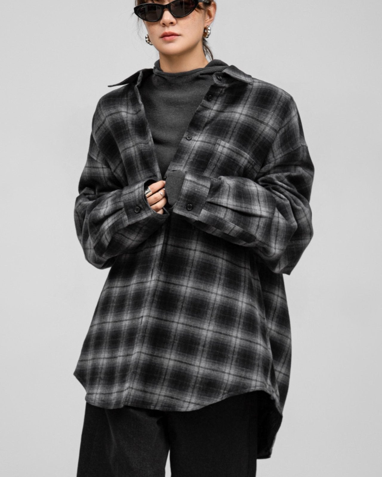 Model wearing the Structured Quilted Check Overshirt open, capturing movement and structured silhouette.