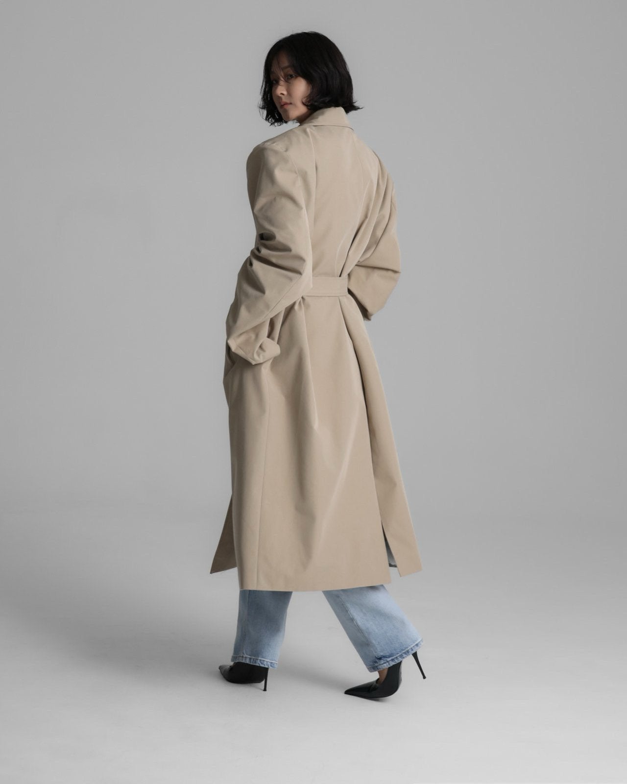 Back view of the Classic Oversized Structured Trench Coat showing belted silhouette and balanced proportions.