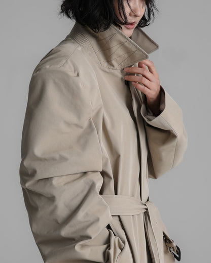 Close-up of the trench coat’s high structured collar and clean stitching detail.
