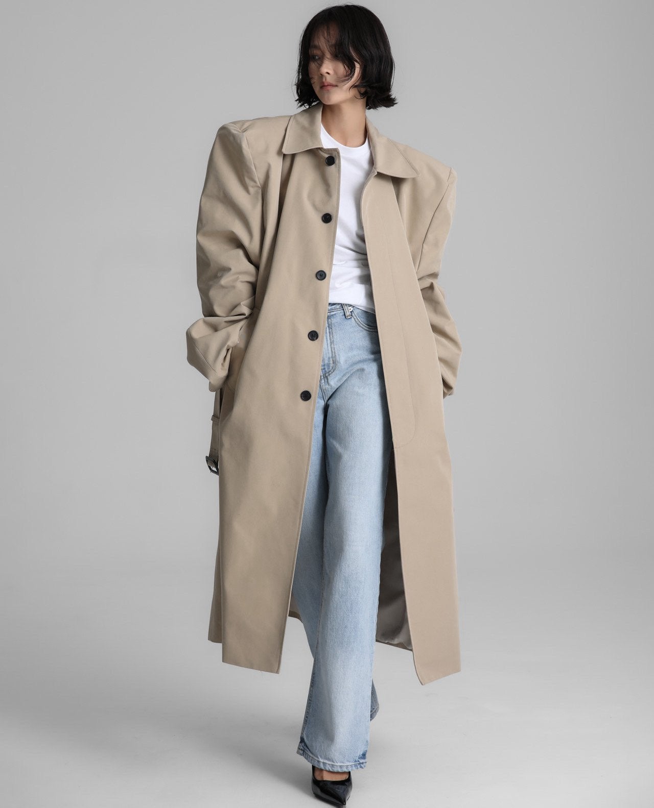 Full front view of the Classic Oversized Structured Trench Coat worn open over denim, showing oversized fit in motion