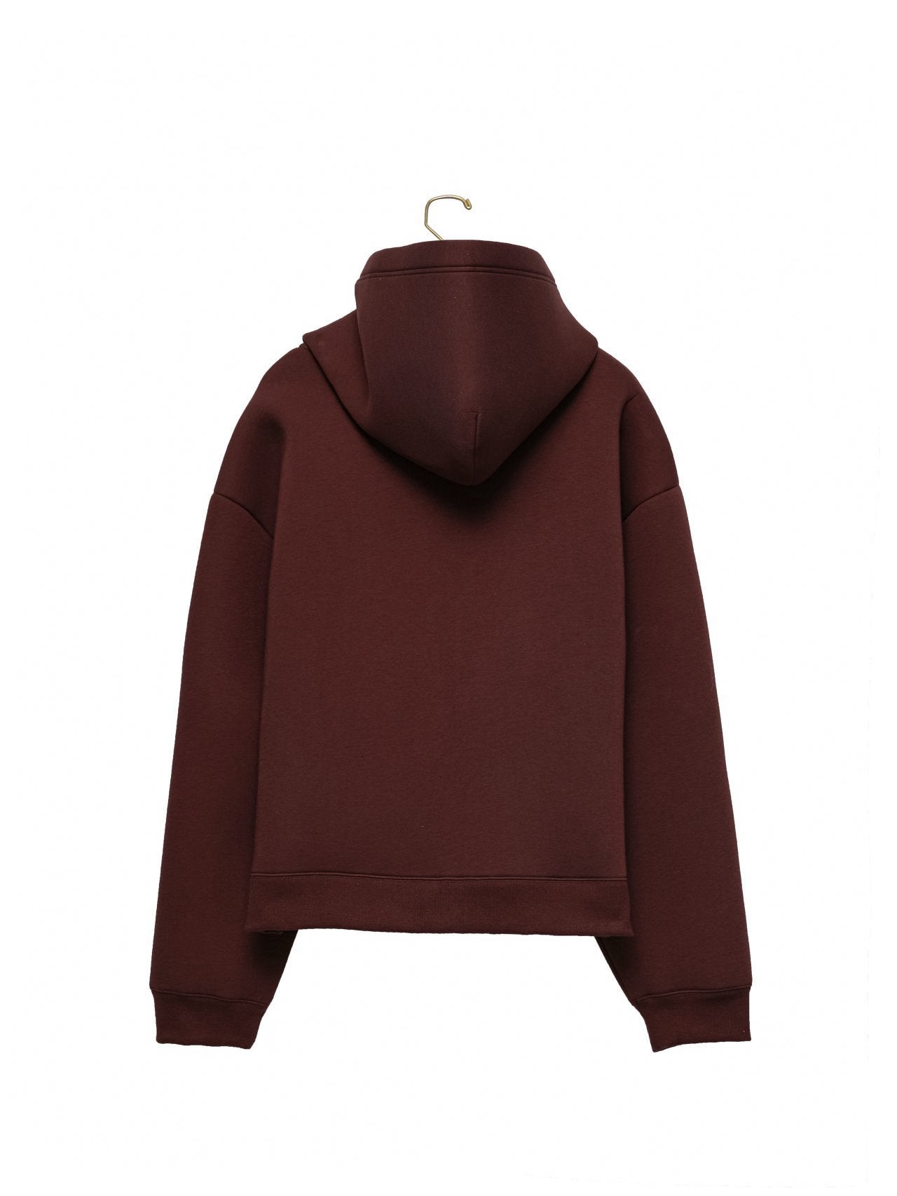 Back view of burgundy neoprene hoodie showing sculptural hood and boxy cut