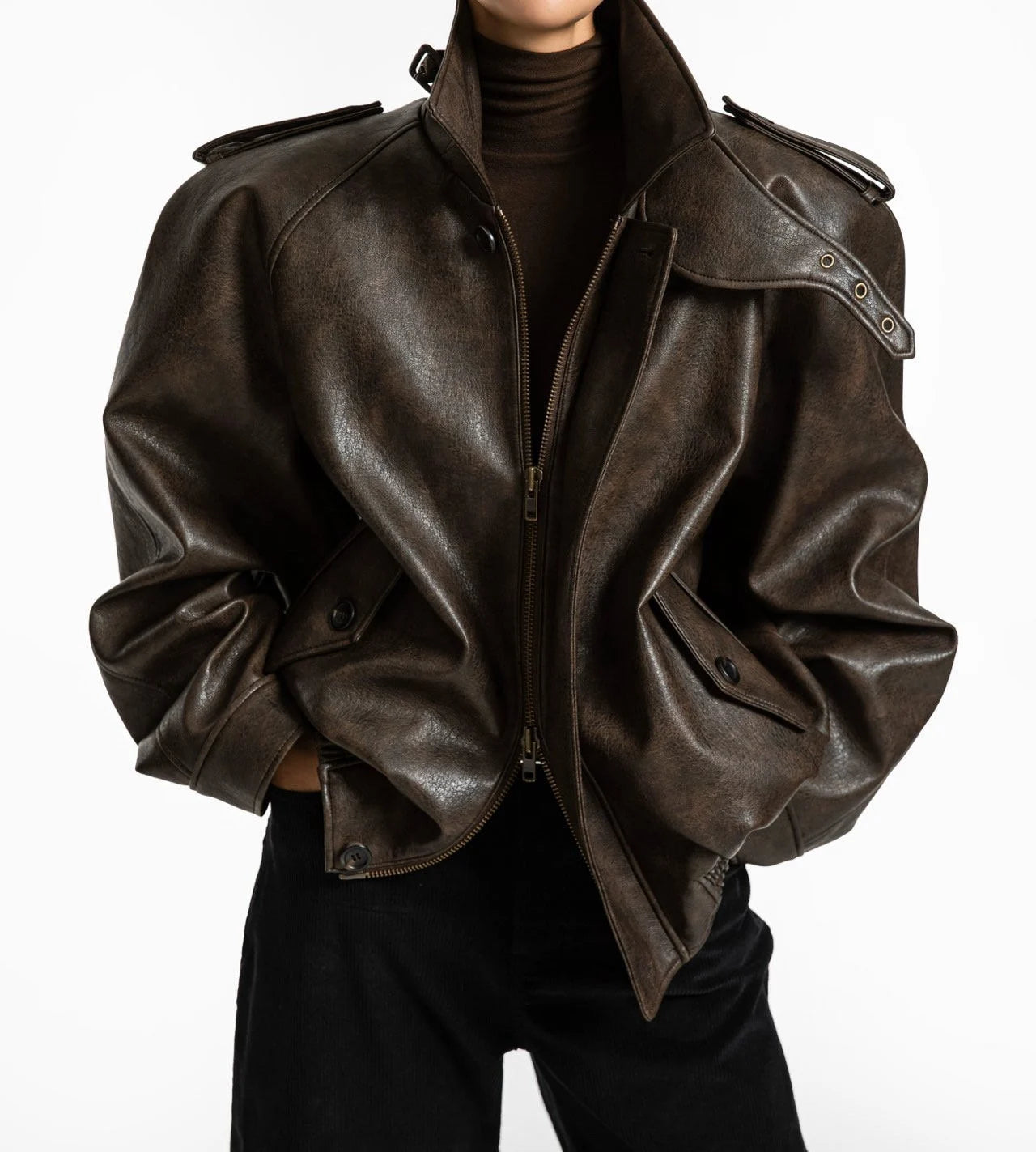 Front view of oversized brown vegan leather bomber jacket with structured collar and epaulettes – CONTOUR New York