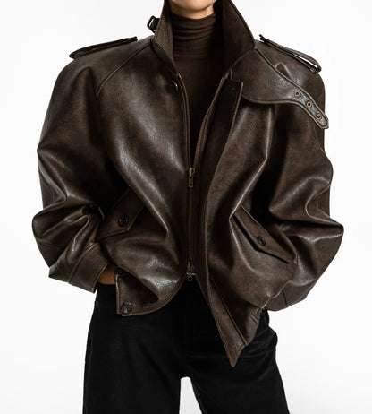 Front view of oversized brown vegan leather bomber jacket with structured collar and epaulettes – CONTOUR New York