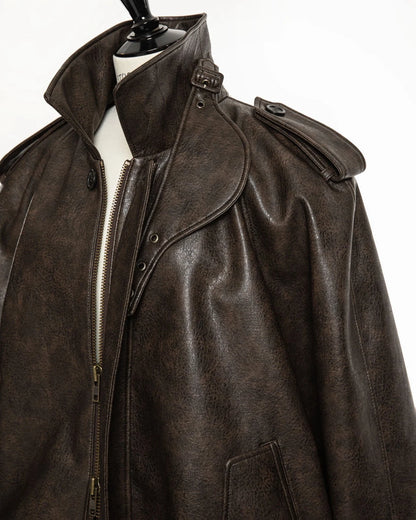 Detailed texture of soft-grained vegan leather fabric with natural sheen