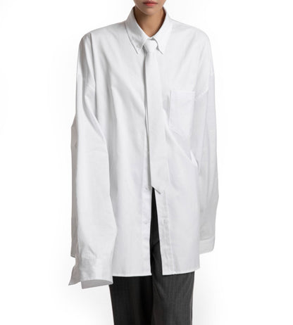Front view of oversized white shirt with structured collar — minimalist wardrobe essential.