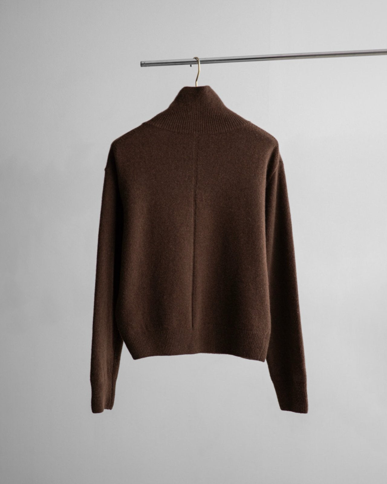 Back view of structured cashmere wool turtleneck sweater in rich chocolate brown