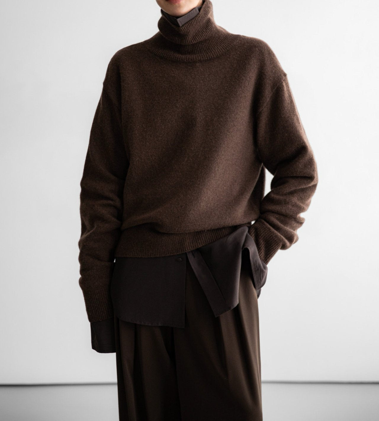Relaxed fit cashmere-blend turtleneck sweater styled in layered tonal outfit – CONTOUR New York